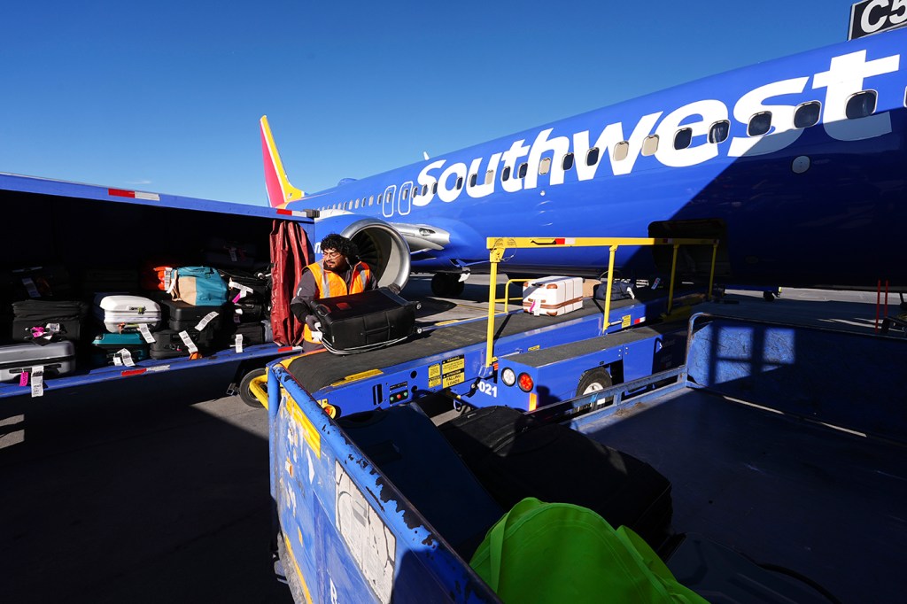 A blue airplane with 'southwest' written on it.