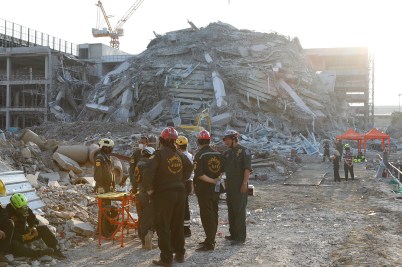 Rescue workers search the rubble of a collapsed building after the Myanmar earthquake.