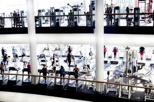 People working on on treadmills and other gym equipment machines in Marino, a gym on the Boston Campus.