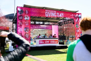 A 'Giving Day' branded stage at the 2025 Giving Day event.