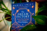 A blue book with the title &#039;The Dream Factory&#039; on it in white text.