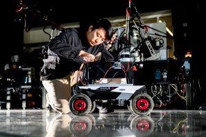 Zihao Dong installing an autonomy kit on a robot.