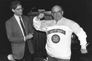 Ed Asner, speaker for the 1989 Commencement, poses in a Northeastern sweatshirt.
