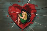 An illustration of a person with long hair sitting with their knees pulled into their chest in the middle of a large red heart with cracks all through it. The person and the heart are on a grey background.