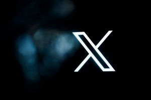 An 'X' shaped logo on a black background.