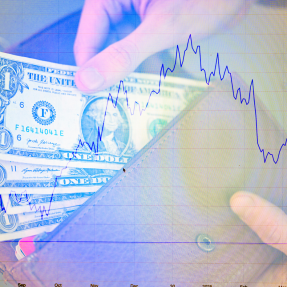 A financial concept image shows a hand pulling U.S. dollar bills out of an envelope overlaid with a declining stock market chart. The image has a purple/blue tinted overlay effect.