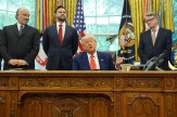 Donald Trump speaks at a trade deal event in the Oval Office with U.K. and U.S. officials.