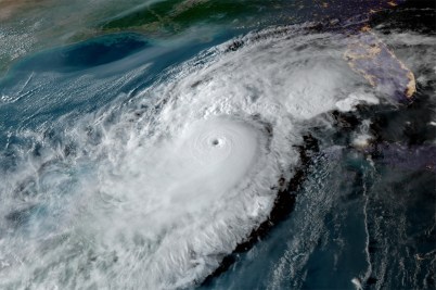 A satellite image of a large circular hurricane storm system.
