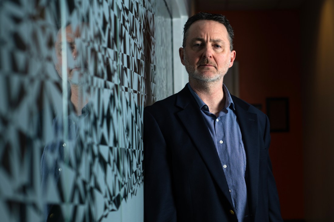 Portrait of Brandon Welsh, wearing a blazer