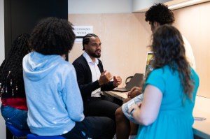 Several students shown talking a Northeastern videographer.