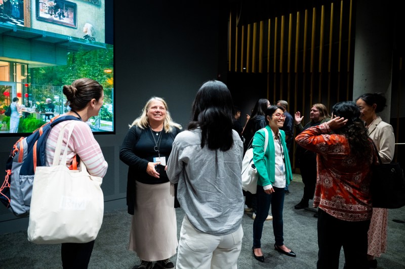 New faculty members speak to each other at a new faculty member event.