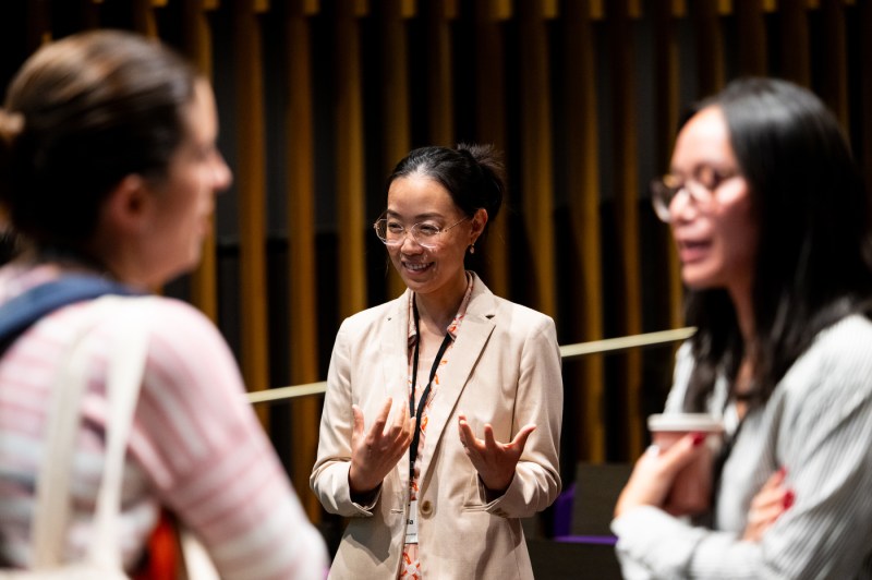 New faculty members speak to each other at a new faculty member event.