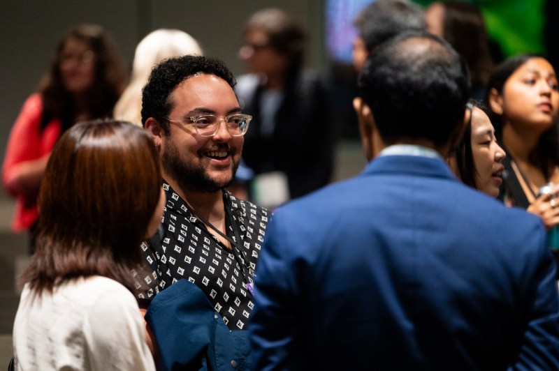 New faculty members speak to each other at a new faculty member event.