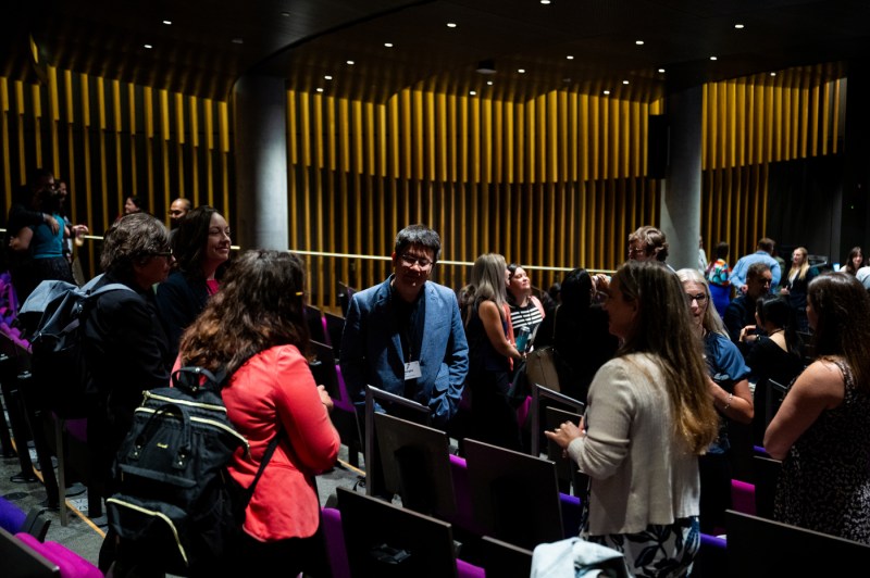 New faculty members speak to each other at a new faculty member event.
