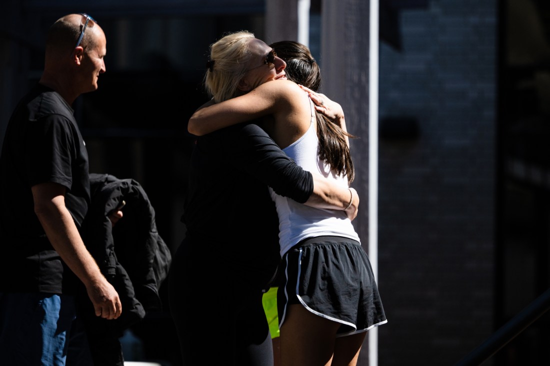 A parent hugs their daughter during move-in week at Northeastern University.