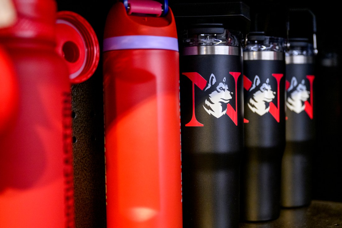 Red and black water Northeastern brand bottles.