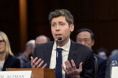 CEO of OpenAI Sam Altman, featured in a suit testifying before a Senate committee.