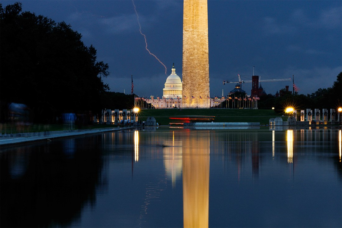 A photo of a lightning strike over the National Mall in Washington D.C. at dark.