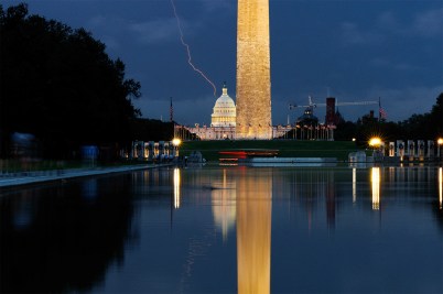 A photo of a lightning strike over the National Mall in Washington D.C. at dark.