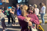 Parents awaiting news of their children and embracing after a mass shooting in Minnesota.