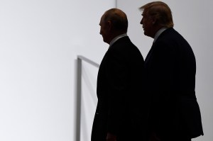 President Trump and President Putin silhouettes seen standing side by side from behind.