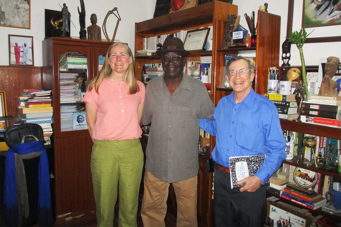 Political scientists Martha Johnson, left, and William Miles, right, pictured with West African Research Center Director Ousmane Sene.
