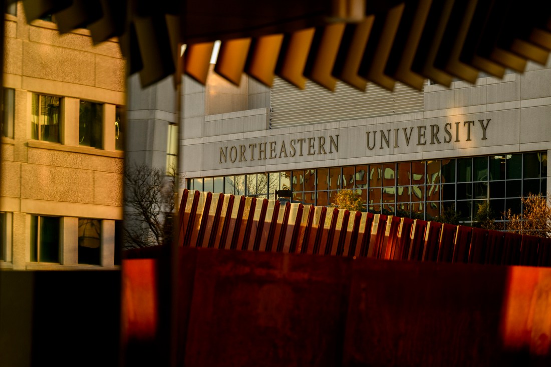 An exterior view of a Northeastern University building at sunset.