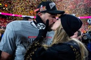 Kansas City Chiefs tight end Travis Kelce and Taylor Swift seen kissing.