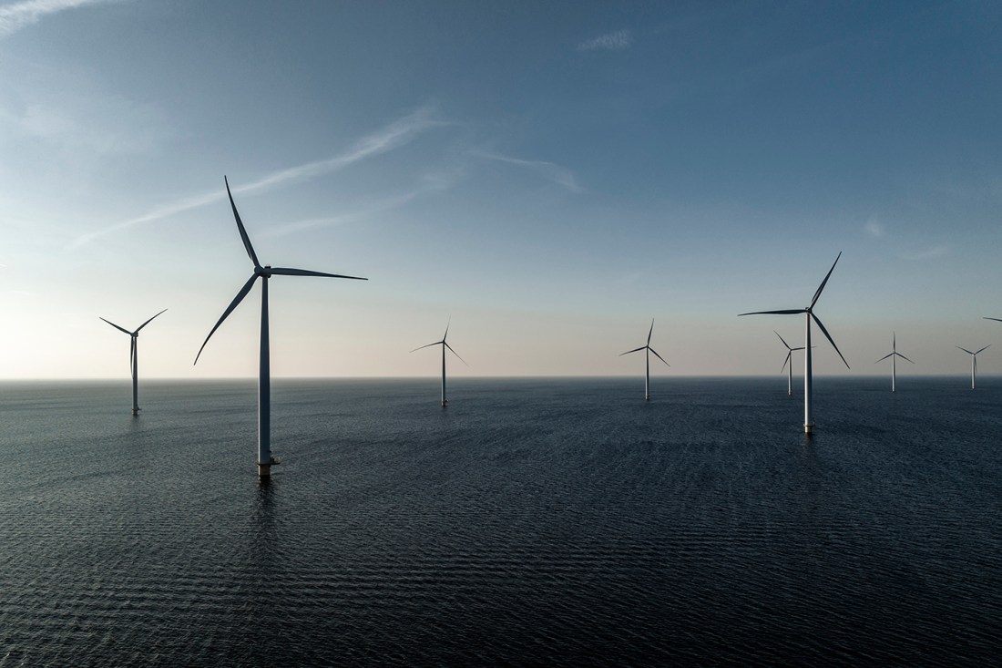 A shot of wind turbines in an offshore wind farm.