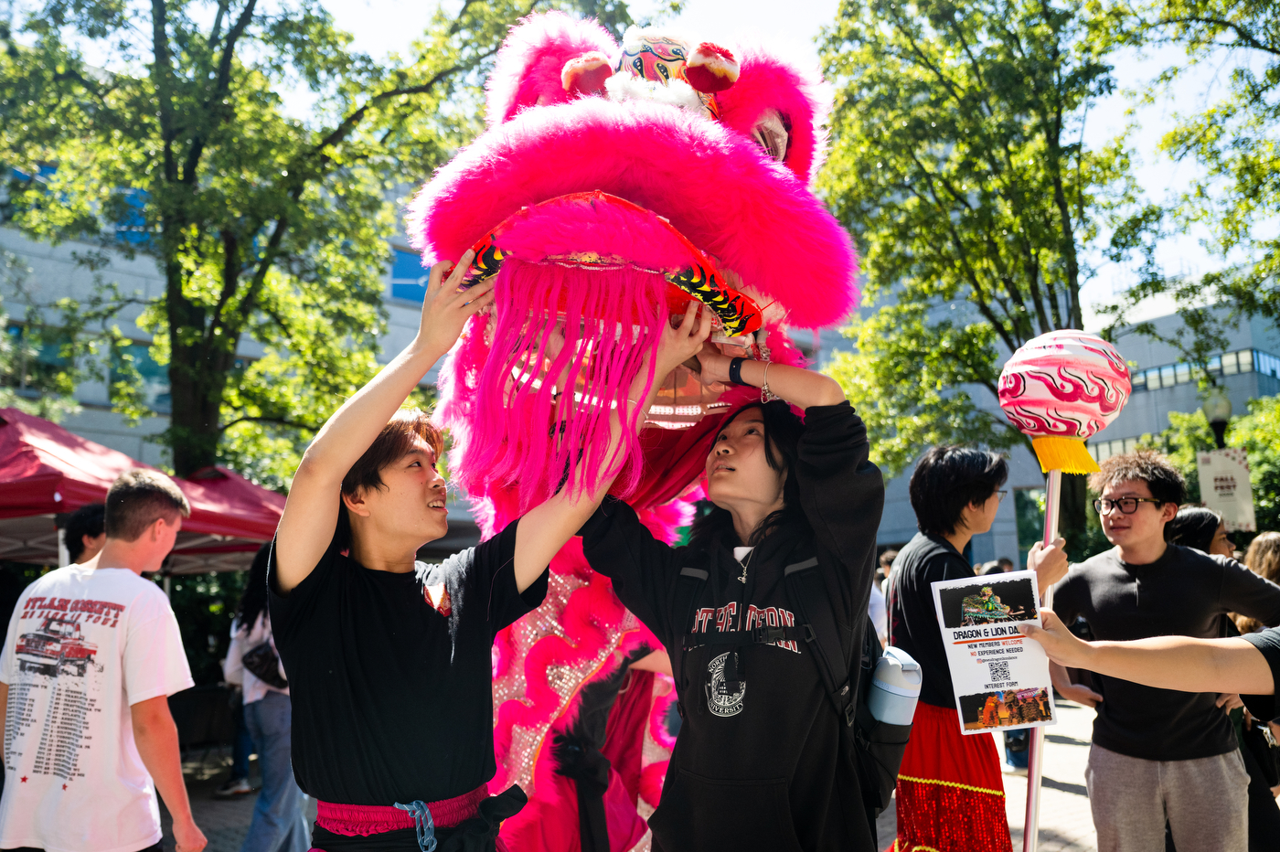 Students in the Dragon and Lion Dance club show off their dragon costume.