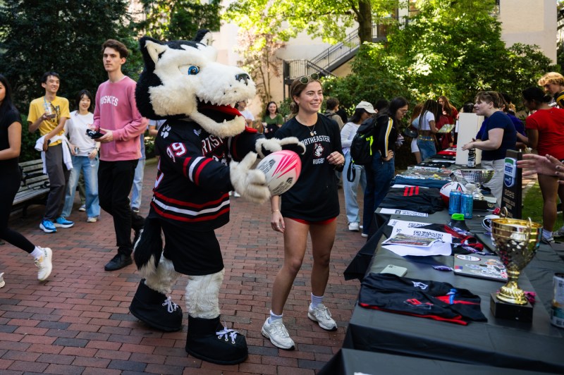 Paws visits the rugby table at Fall Fest.