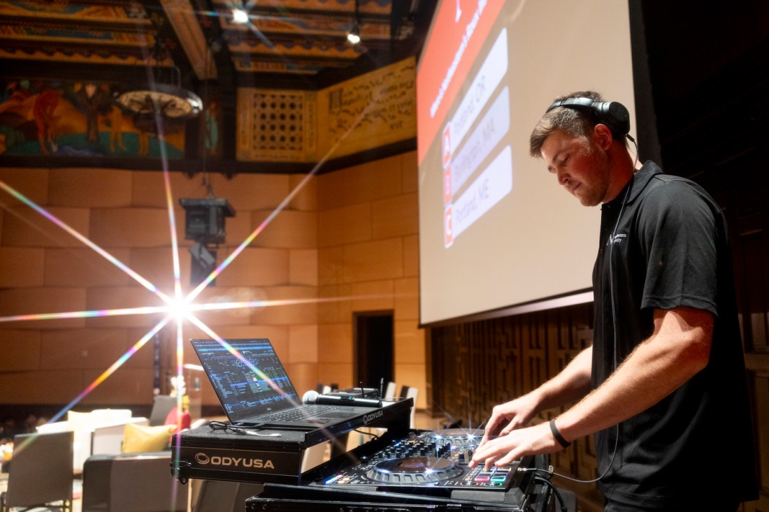 A DJ performs inside Littlefield Concert Hall during Northeastern’s Oakland campus welcome event.