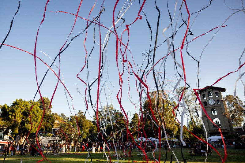 Streamers fly through the air outside on the Oakland campus.