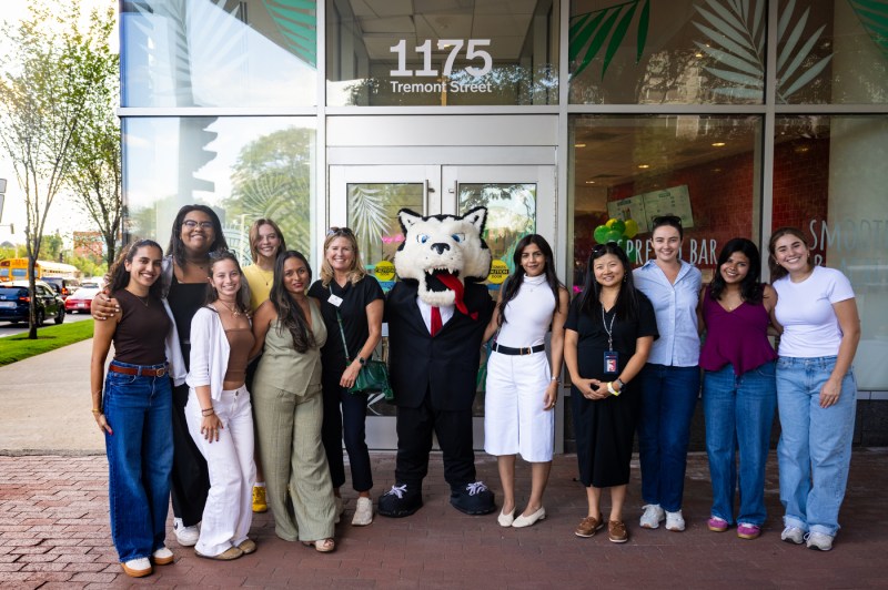 Ammy Lowney, the founder of Juicygreens, pictured with a large group of people, including Paws.