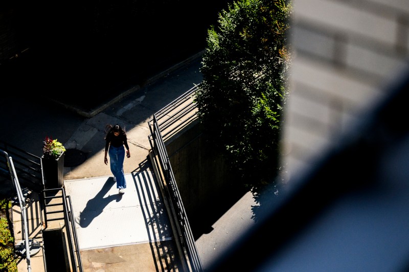 A person walks through campus.