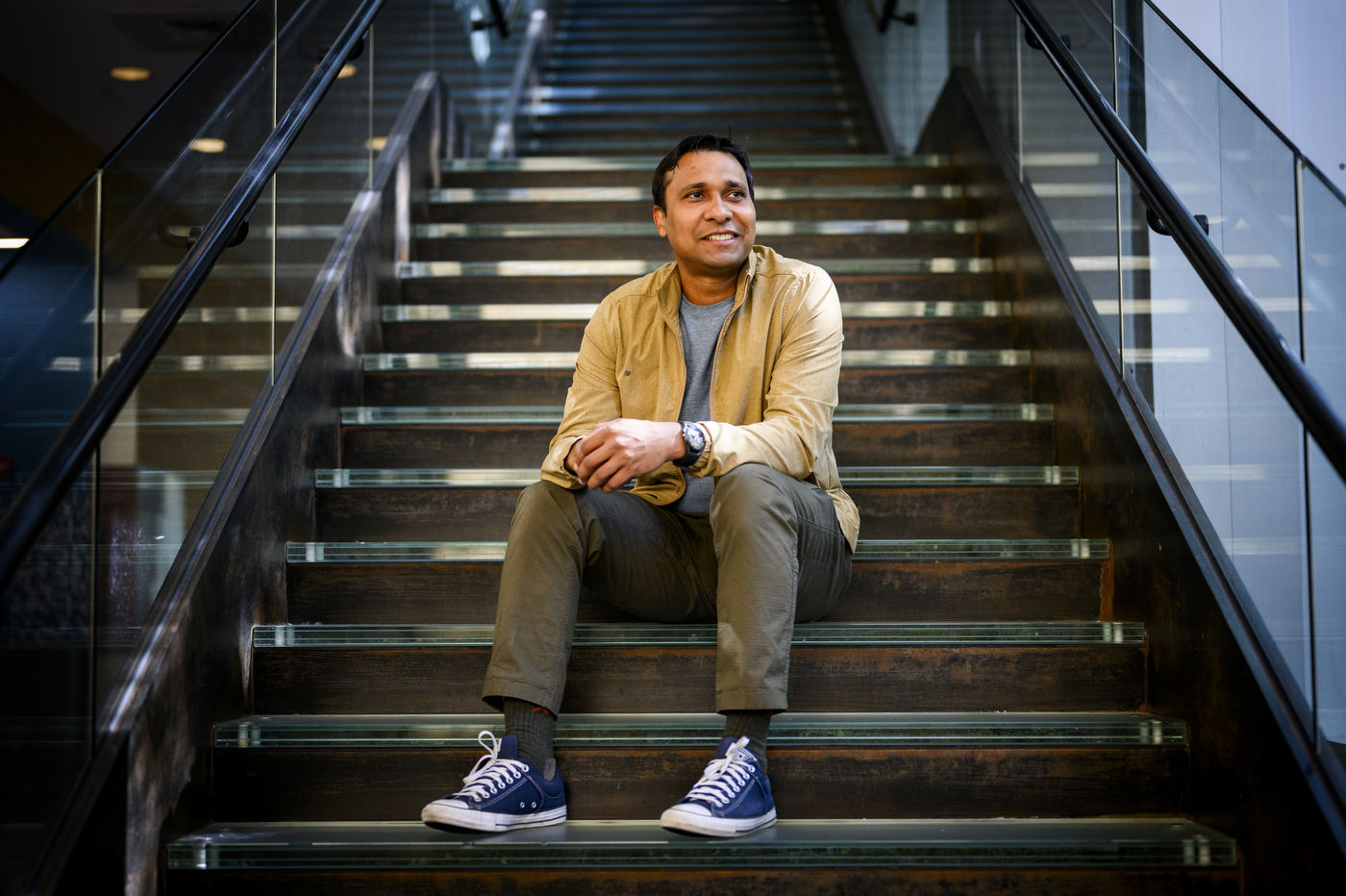 Prashant Pandey sits on a set of stairs.