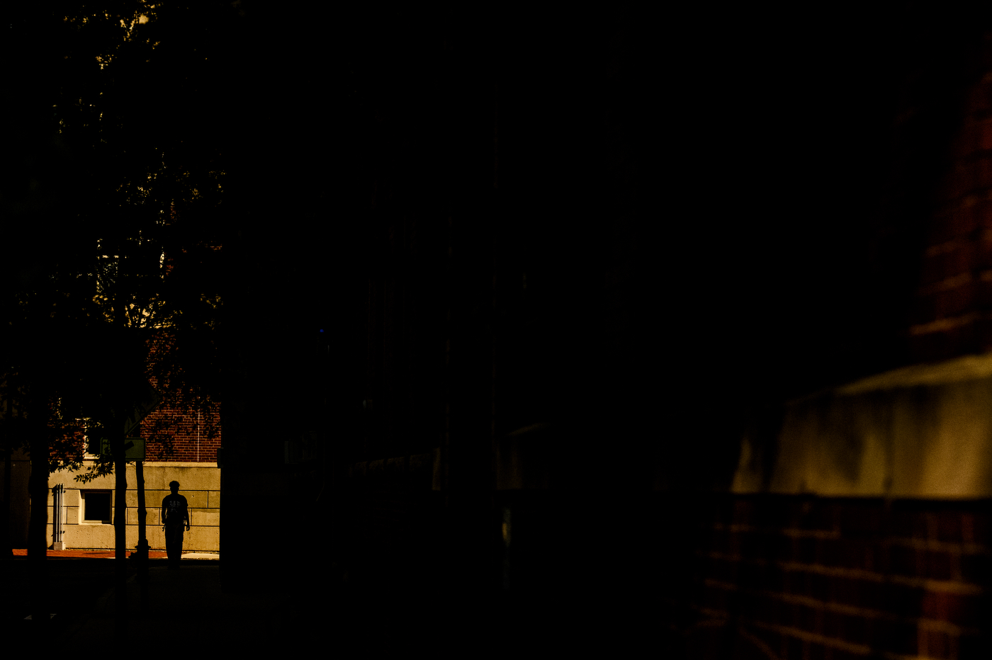 A person walks through campus.