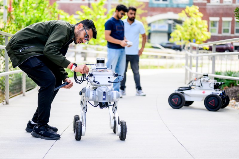 Students test robots outside on the Boston campus.