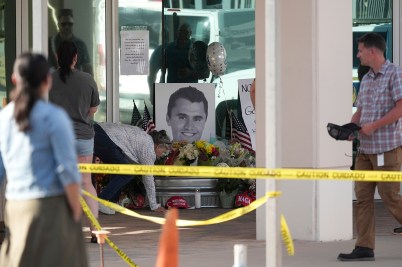 A makeshift memorial depicting the smiling face of Charlie Kirk.