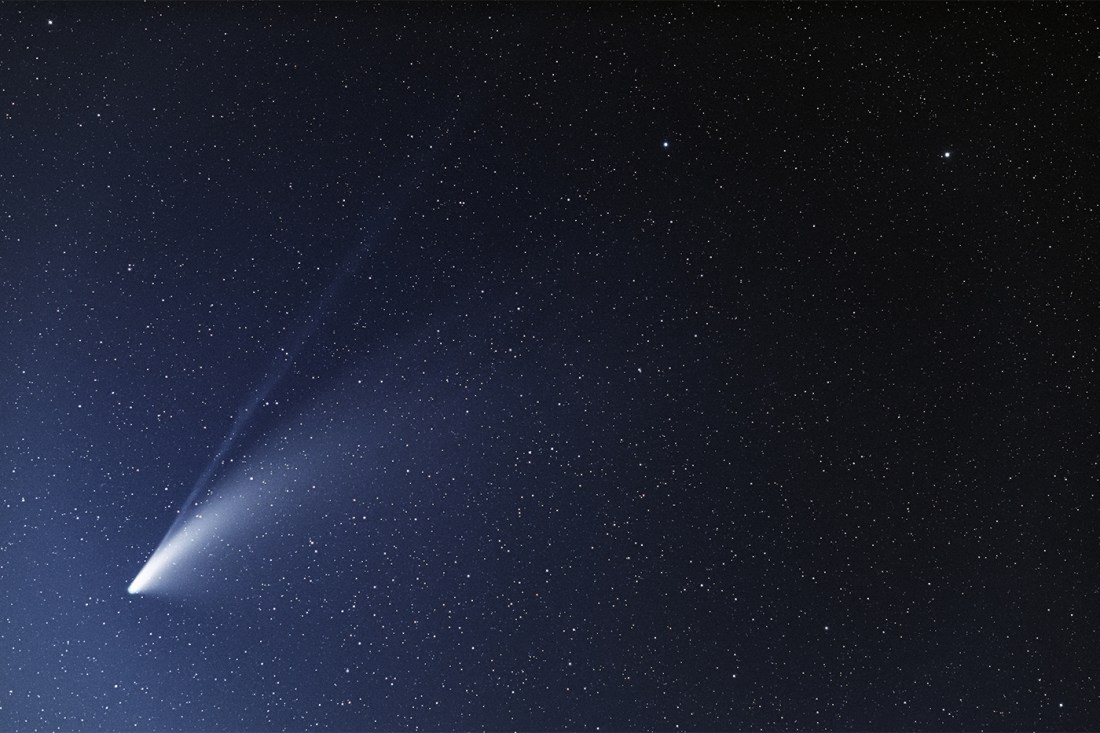 A comet shining in the night sky.