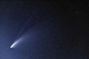 A comet shining in the night sky.