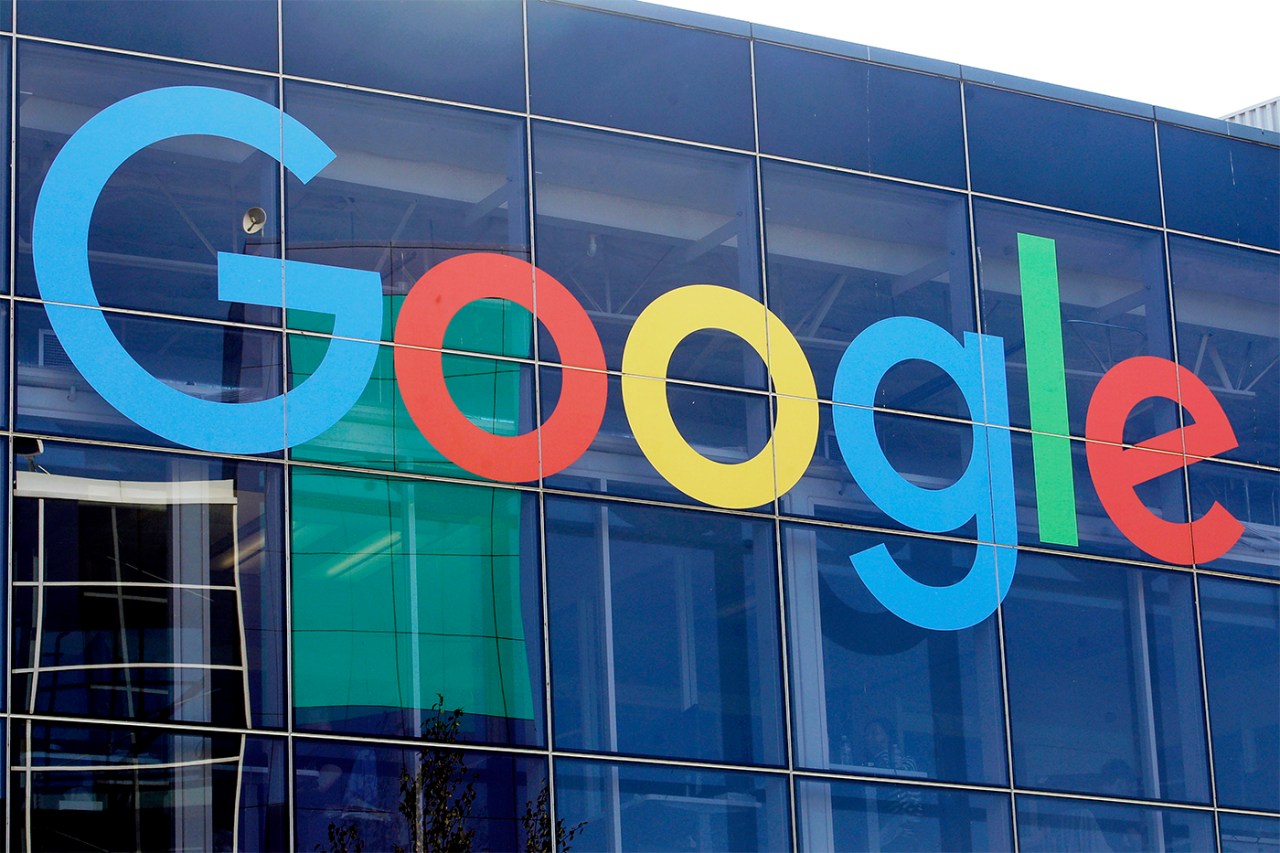 A photo of the Google logo displayed on the front of their office building.