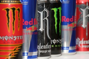 Various red, blue and black cans of energy drinks.