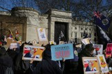 Protestors gathered with signs against China&#039;s plans to set up an embassy near the Tower Bridge.