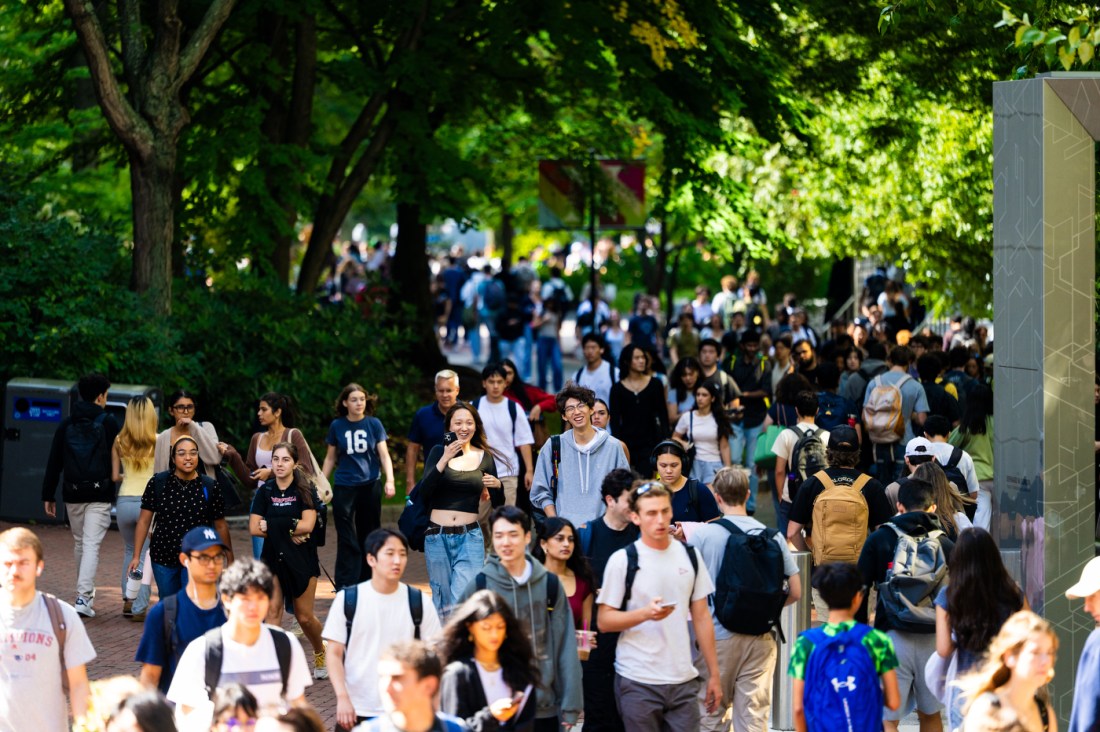 Crowds of students walk through Northeastern's Boston campus in between classes.