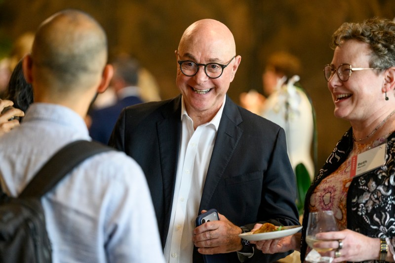 President Aoun speaks with other faculty members.
