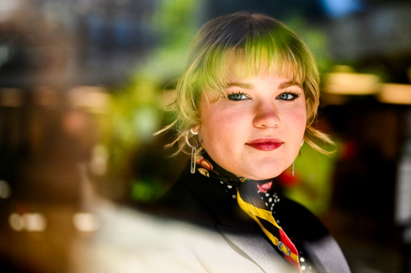Haylen Wehr, an international business student, with short blonde hair, looking at the camera.