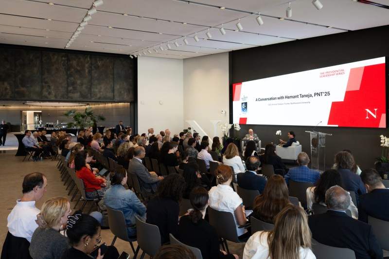 Northeastern president Joseph E. Aoun speaks with General Catalyst CEO Hemant Taneja during a fireside chat in EXP on Oct. 6, 2025, as a full audience looks on.
