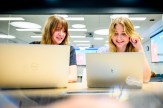 Casey Laguna and Elizabeth-Anne Burgett, both members of the Engineers Without Borders Club, work on a project in the ISEC building.