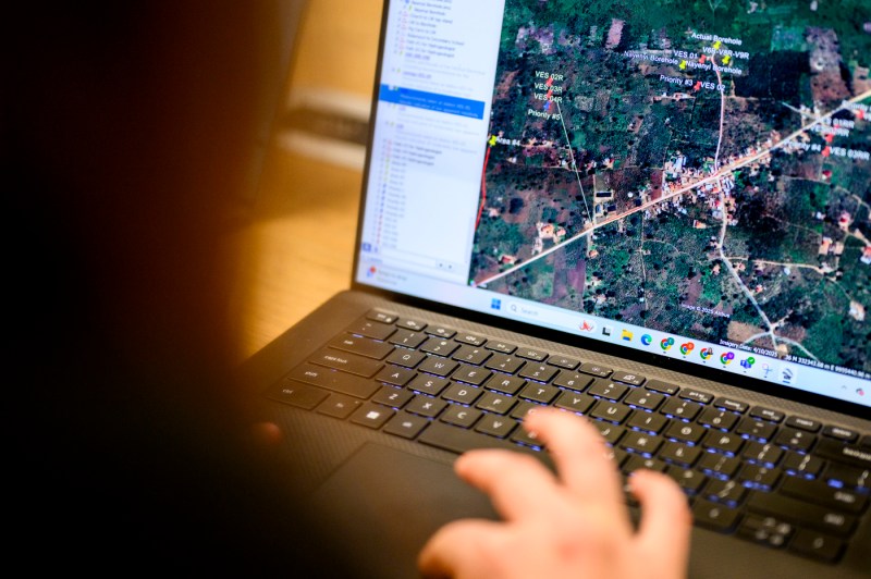 A student looks at a GPS map on a laptop.